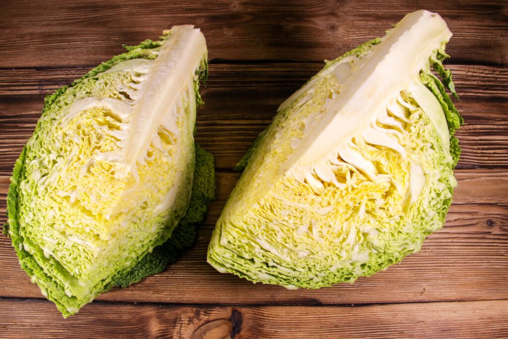 Savoy cabbage on wooden table