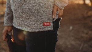close up pot of a Stormy Kromer tag on womans shirt