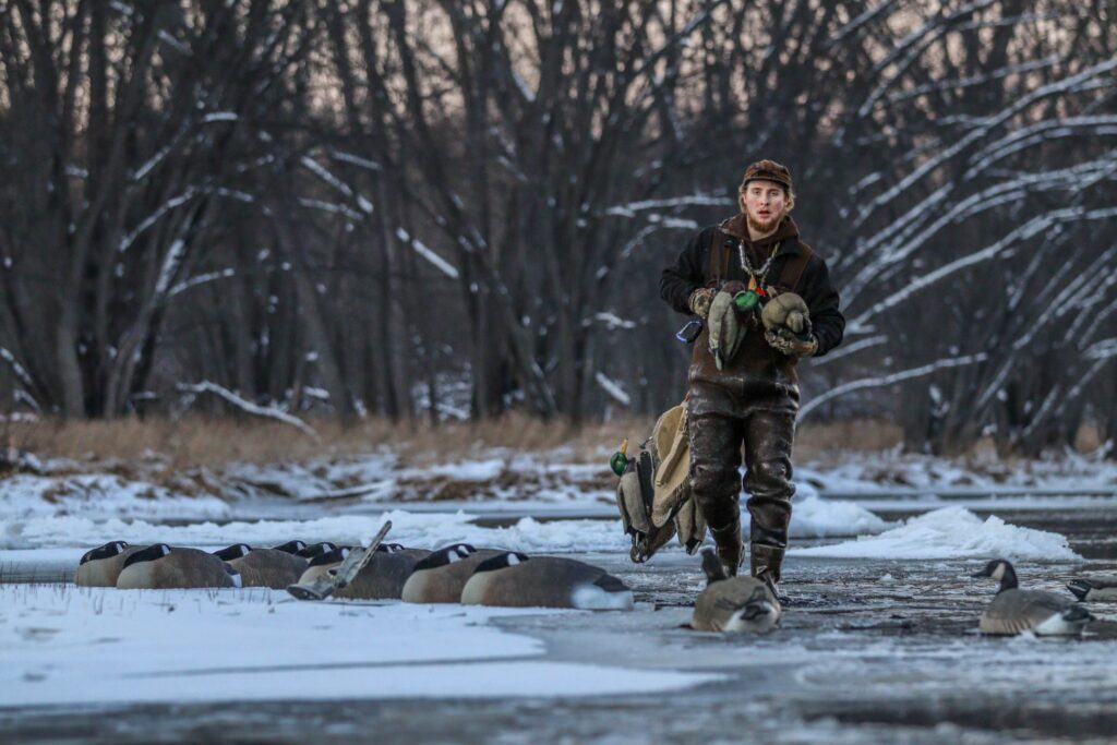 Dakota out in the woods walking to a duck hunting location