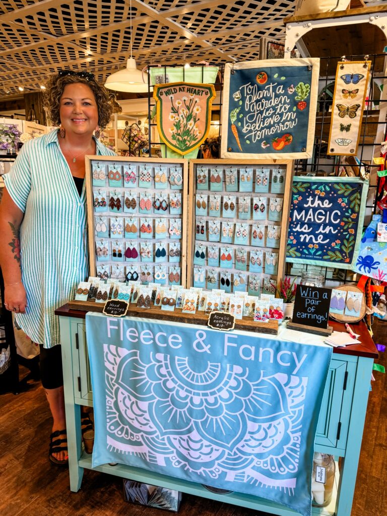 Fleece & Fancy owner, Kristin Rice, poses beside her booth