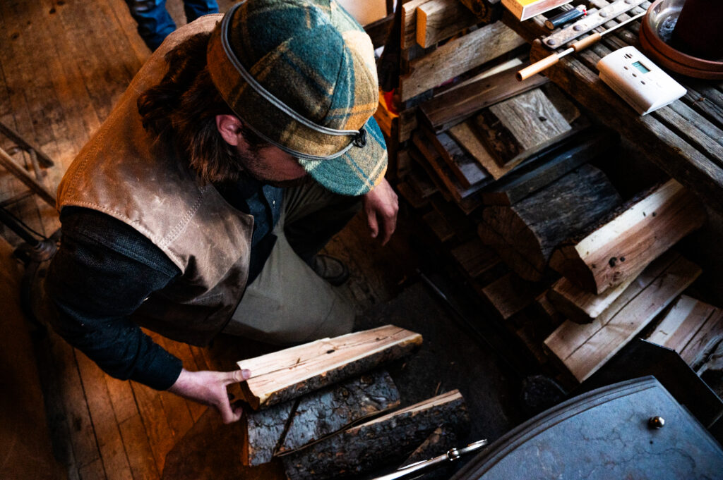 A man wears the Original Stormy Kromer Cap - Isle Royale Collection from Stormy Kromer and American Woolen.