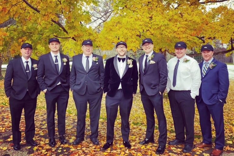 Scott Reddinger poses with groomsmen. Everyone is wearing a Stormy Kromer cap.